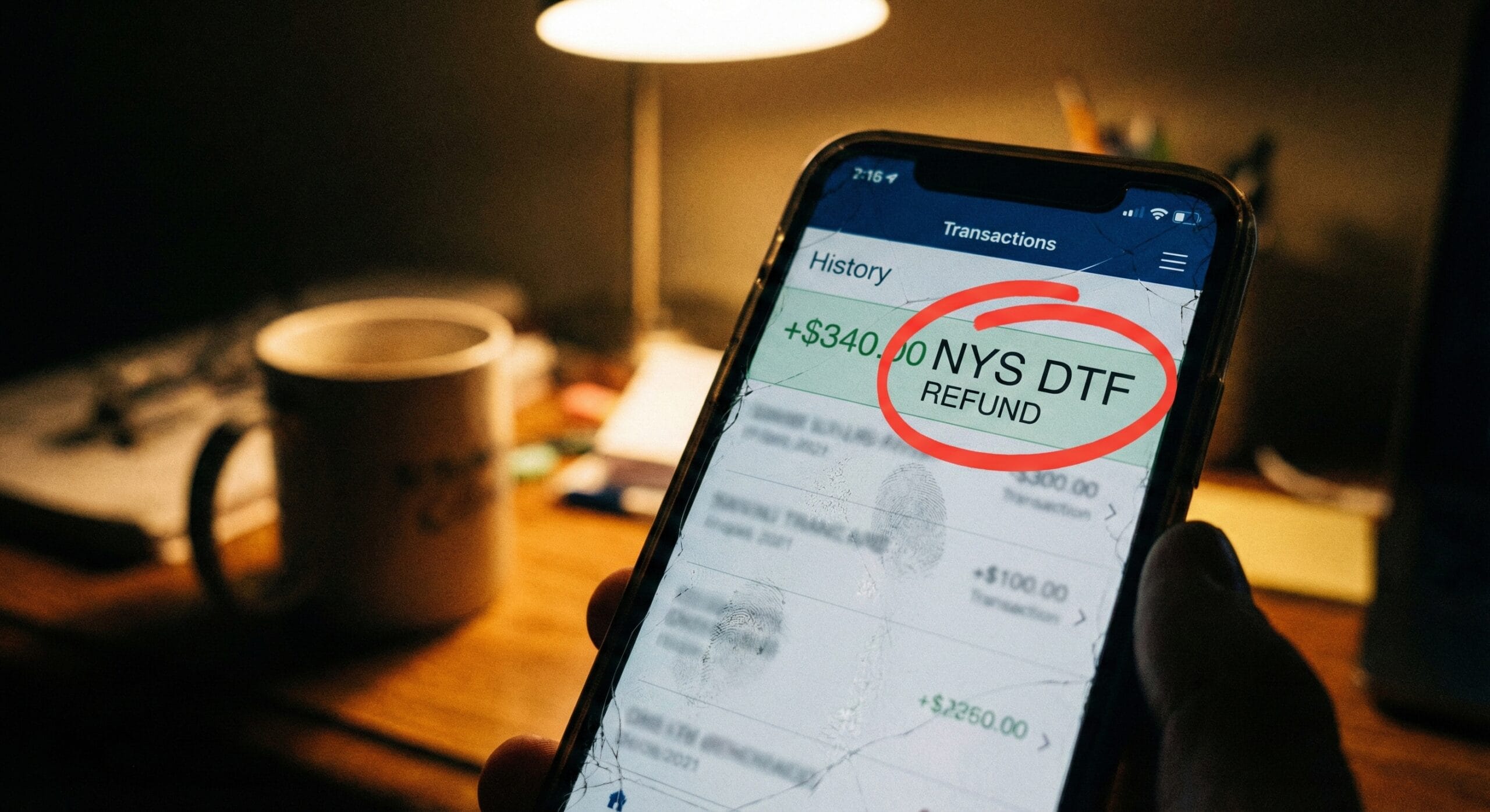 A smartphone screen showing a bank transaction list with a small deposit labeled "NYS DTF REFUND" circled in red.